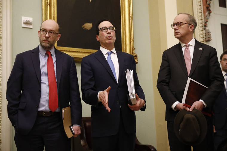 ASSOCIATED PRESS
                                Treasury Secretary Steve Mnuchin, center, spoke with members of the media as he departs a meeting with Senate Republicans on an economic lifeline for Americans affected by the coronavirus outbreak. on Capitol Hill in Washington, Monday.
