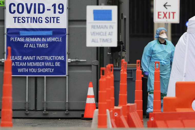 ASSOCIATED PRESS
                                Medical personnel conduct drive-through COVID-19 coronavirus testing at a hospital in Park Ridge, Ill., on March 19.
