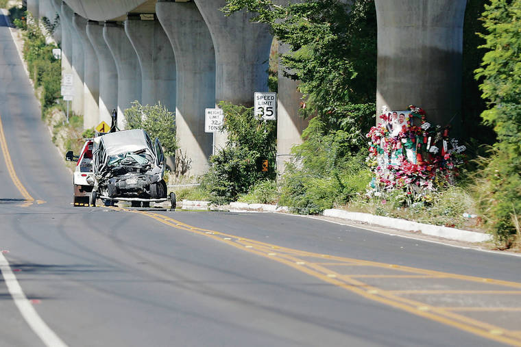 CINDY ELLEN RUSSELL / CRUSSELL@STARADVERTISER.COM
                                Max Maneafaiga, 57, died Sunday morning after his pickup truck struck a concrete rail transit pillar near Kahi Mohala in Waipahu. The truck was towed away past a memorial for a previous accident along Farrington Highway.