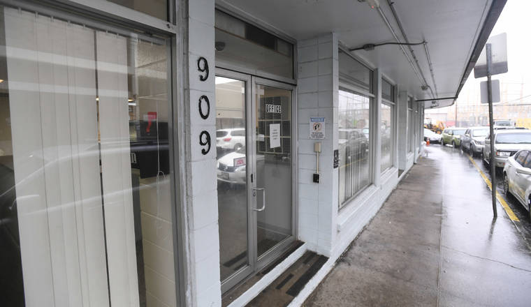 BRUCE ASATO / BASATO@STARADVERTISER.COM
                                The empty building at 909 Kaamahu Place, across the Institute for Human Services’ Kaaahi St. Women and Family shelter, is expected to open Wednesday to treat potential homeless people afflicted with the novel coronavirus.