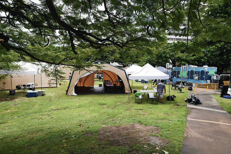 BRUCE ASATO / BASATO@STARADVERTISER.COM
                                The city’s HONU program (Homeless Outreach and Navigation for Unsheltered Persons) began operation in Old Stadium Park on Monday.