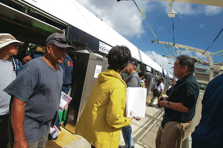 CINDY ELLEN RUSSELL / FEB. 8
                                The first leg of the rail line is schedule to begin by December. HART opened the Halaulani station at Leeward Community College for a public preview. Above, residents disembark the train at the transit station during its open house.
