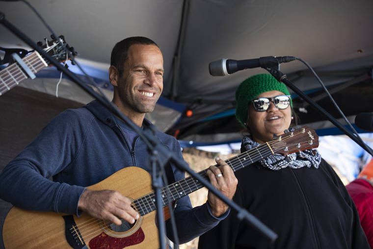 STAR-ADVERTISER / JULY 2019
                                Musician Jack Johnson played at Mauna Kea Access Road. Pictured to the right of Jack Johnson is Paula Fuga. Johnson, a goodwill ambassador for the United Nations Environment Programme, offered the concert on Instagram live in collaboration with Global Citizen to support WHO in its message encouraging everyone to practice social distancing.