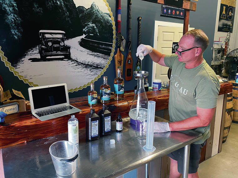 COURTESY ERIC DILL
                                Ian Brooks, co-founder of Ko‘olau Distillery, made hand sanitizer at the company’s Kailua facility.