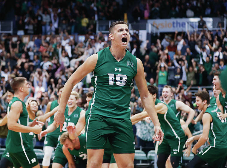 CINDY ELLEN RUSSELL / CRUSSELL@STARADVERTISER.COM
                                Hawaii’s Rado Parapunov turned to the crowd as the Rainbow Warriors stormed the court after defeating BYU last Friday at the Stan Sheriff Center.
