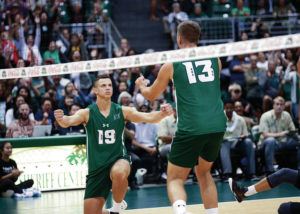 CINDY ELLEN RUSSELL / CRUSSELL@STARADVERTISER.COM 
                                Hawaii opposite Rado Parapunov (19) drops to his knee at teammate Max Rosenfeld (13) after he made a kill during the third set against the BYU Cougars at Friday’s match.