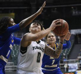 2020 March 4 SPT HSA Photo by Bruce Asato
Hawaii guard Julissa Tago (0) maneuvers in the lane defended by UCSB guards Danae Miller (0) and Johnni Gonzalez (1) in the first quarter of the UC Santa Barbara vs the University of Hawaii  women's basketball game at Stan Sheriff Center, Wednesday, March 4, 2020.