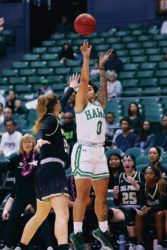 ANDREW LEE / SPECIAL TO THE STAR-ADVERTISER
                                Hawaii’s Julissa Tago fired a 3-point shot during the first quarter against Cal Poly on Saturday.