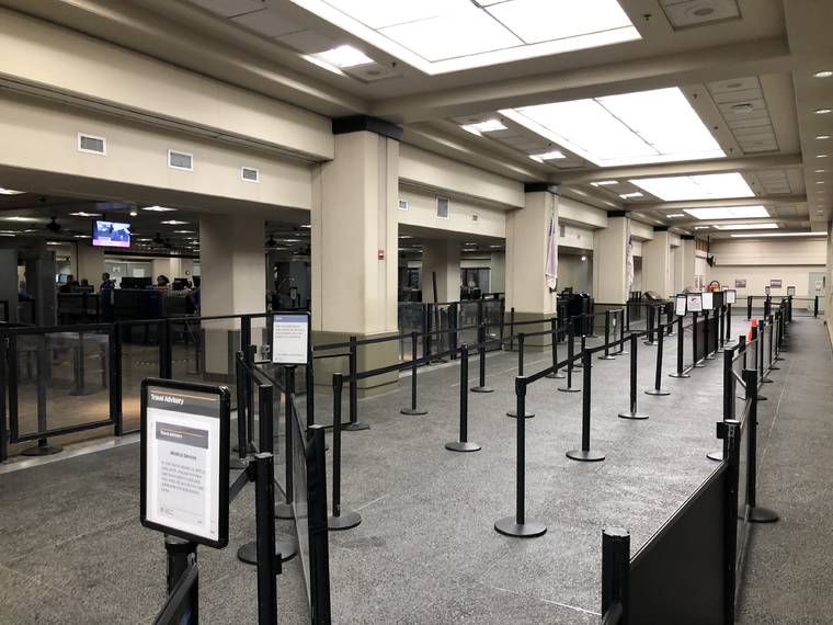 CHRISTIE WILSON / MARCH 30
                                The Daniel K. Inouye International Airport is seen as empty following Gov. David Ige’s announcement of new quarantine rules for interisland travelers.