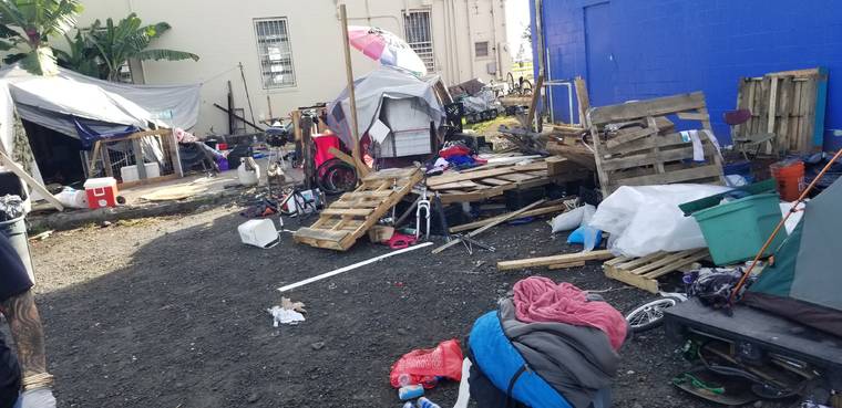 COURTESY HAWAII ISLAND POLICE DEPARTMENT                                 Police removed about a dozen people squatting on land behind Agasa Furniture today in Hilo. This photo shows the lot today before it was cleaned up.