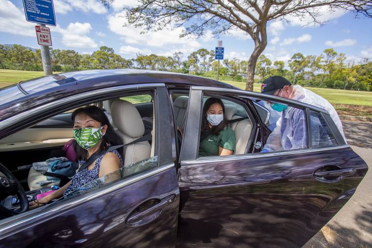 DENNIS ODA / APRIL 15
                                Kalihi Kai Urgent Care conducted a drive-thru COVID-19 testing at the Asing Community Park across from the West Loch Elderly Village in Ewa Beach last week.