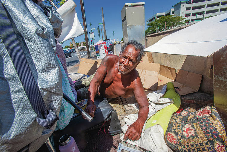 DENNIS ODA / DODA@STARADVERTISER.COM
                                71-year-old Daniel Cuevas, pictured at River and King streets, has been living on the streets for 40 years and got emotional talking about how hard it is.