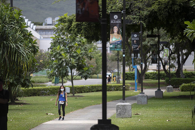CINDY ELLEN RUSSELL / CRUSSELL@STARADVERTISER.COM
                                A solitary woman wearing a mask walks at the University of Hawaii at Manoa campus on Monday. Hawaii’s tally of coronavirus cases has risen to 613, up four from Tuesday, health officials said today, with more than 84% of the patients classified as recovered.
