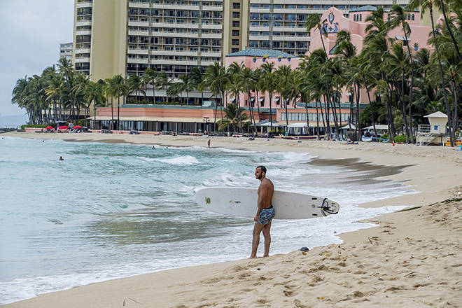 DENNIS ODA / MARCH 26
                                By the end of March, Waikiki Beach was nearly empty as coronavirus restrictions took a devastating toll on Hawaii’s tourism industry.