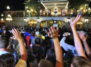 ORLANDO SENTINEL VIA ASSOCIATED PRESS
                                Guests wave goodbye to Mickey Mouse and friends on Main Street USA, in the Magic Kingdom at Walt Disney World, after the characters made a surprise appearance in the final minutes before the park closed, March 15.