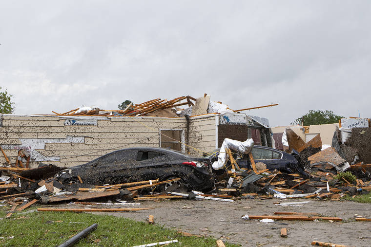 THE NEWS-STAR VIA AP
                                A home had its roof torn off after a tornado ripped through Monroe, La.