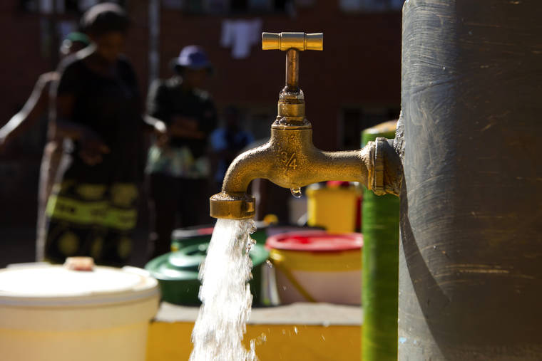 ASSOCIATED PRESS
                                Water flows from a communal tap that the group Doctors Without Borders provided in a suburb of Harare, Zimbabwe.