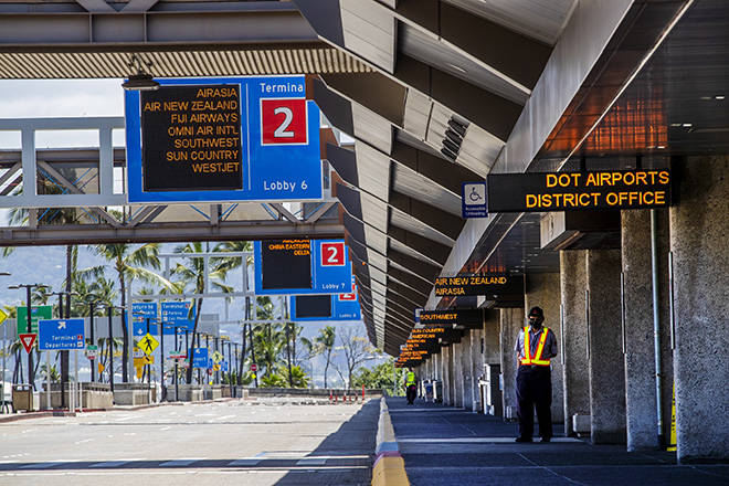 DENNIS ODA / APRIL 19
                                Daniel K. Inouye International Airport in Honolulu sees a few hundred travelers a day since the state imposed a 14-day quarantine for arriving passengers. The move has helped “flatten the curve” of COVID-19 infections in Hawaii but also devastated the state’s economy.