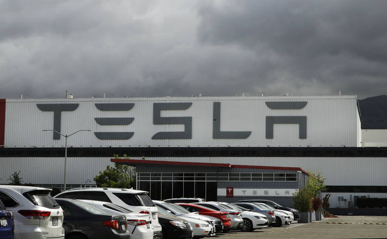 ASSOCIATED PRESS
                                The Tesla plant in Fremont, Calif., reopened Monday.