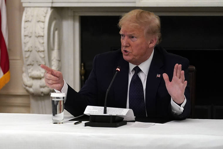 ASSOCIATED PRESS
                                President Donald Trump tells reporters that he is taking zinc and hydroxychloroquine during a meeting with restaurant industry executives about the coronavirus response, in the State Dining Room of the White House today.