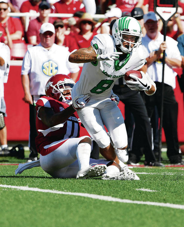 ASSOCIATED PRESS / 2018
                                Former North Texas receiver Rico Bussey Jr. tried to pull away from Arkansas’ Ryan Pulley during a game in 2018. Bussey caught 12 touchdown passes that season.