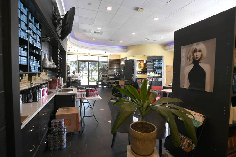 BRUCE ASATO / APRIL 26
                                Hair salons can operate on Oahu as of today.
