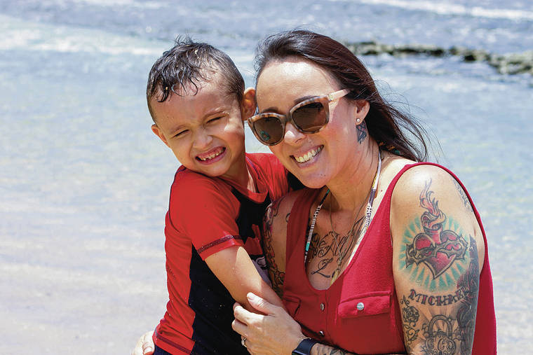 MEGAN MOSELEY / SPECIAL TO THE STAR-ADVERTISER
                                Six-year-old Hunter Steven is autistic and receives one-on-one education at King Kamehameha III Elementary School. He has been out of school for the past few weeks due to the ongoing stay-at-home orders. Above, Hunter enjoyed some recent beach time with his mother, Rachel, in Honokowai.