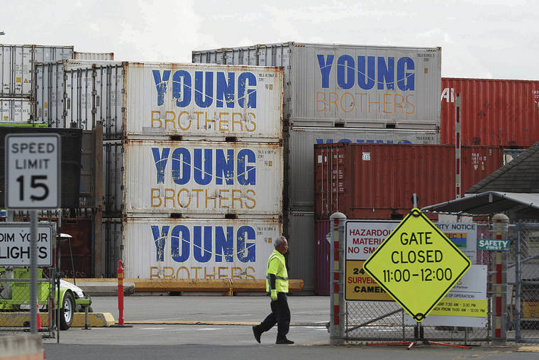 GEORGE F. LEE / GLEE@STARADVERTISER.COM
                                Young Brothers is asking for $25 million from the state’s share of federal COVID-19 emergency funding. A worker walked past the gate at Piers 39 and 40 on Tuesday.