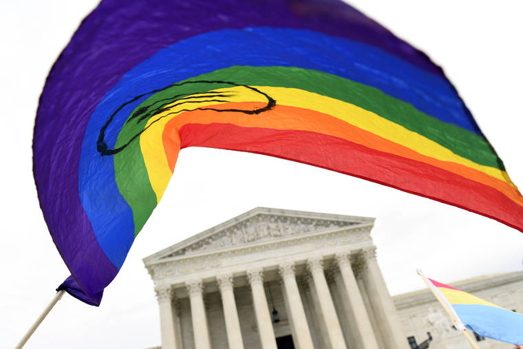 ASSOCIATED PRESS
                                People gather outside the Supreme Court in Washington in 2019. The Supreme Court’s Monday ruling shielding LGBT people from employment discrimination dealt a blow to religious conservatives — and was penned by a justice they lauded after his nomination by President Donald Trump.