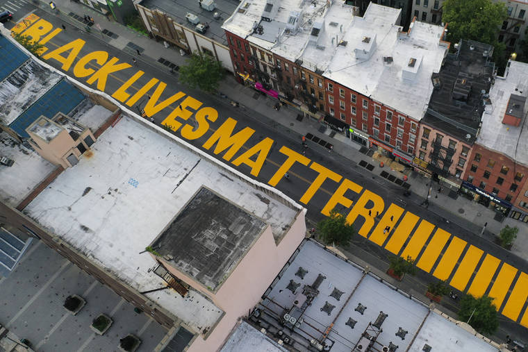 ASSOCIATED PRESS
                                In this June 15, 2020, file photo, a sign reading “Black Lives Matter,” is painted in orange on Fulton Street in the Brooklyn borough of New York. Today, President Donald Trump used Twitter to voice his displeasure with New York City Mayor Bill de Blasio’s plan to paint “Black Lives Matter” in front of Trump’s namesake Manhattan tower.