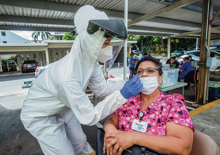 DENNIS ODA / DODA@STARADVERTIER.COM
                                The Premier Medical Group Hawaii is testing its health care workers at the Arcadia facility. Veronica Lazo got tested Tuesday by Kaela Akina-Magnussen.
