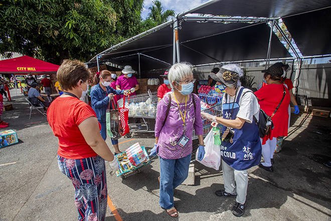 STAR-ADVERTISER
                                At Hawaii Cedar Church in Kalihi, there was a food distribution for the needy and homeless. The church wants to reinforce the importance of donating food to homeless people during the coronavirus pandemic.