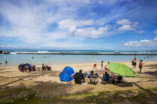 DENNIS ODA /DODA@STARADVERTISER.COM
                                Waikiki Beach was relatively uncrowded on Father’s Day Sunday as the 14-day quarantine for trans-Pacific arrivals continues in Hawaii as a key part of the state’s measures to combat the spread of coronavirus in the islands.