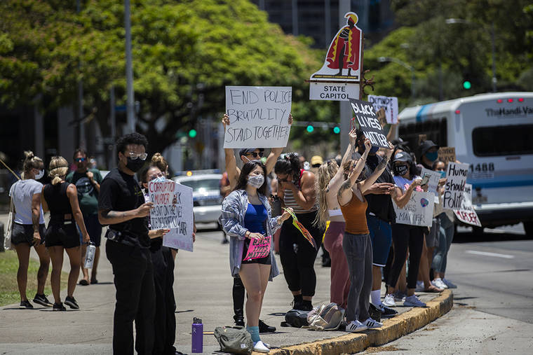 CINDY ELLEN RUSSELL / CRUSSELL@STARADVERTISER.COM
                                About 120 demonstrators gathered at the state Capitol this afternoon in support of the Black Lives Matter movement, a years-long effort calling for equality for black Americans.