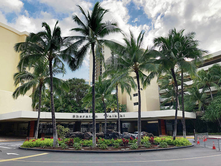 GEORGE F. LEE / GLEE@STARADVERTISER.COM
                                The Sheraton Waikiki remained closed Saturday as Honolulu slowly reopened its restaurants during the weekend. The pressure to bring back tourists without the 14-day quarantine is intense.