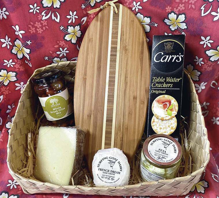 COURTESY PHOTO
                                Surfing Goat Dairy’s cheese board baskets contain a wedge of Spanish manchego, a 4-ounce French Dream goat cheese “biscuit,” jars of feta cheese and Kalamata olives, surfboard-shaped bamboo cutting board and a box of crackers for $65.