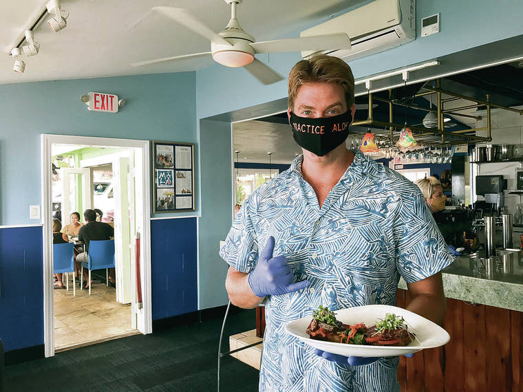 CARLA TRACY / SPECIAL TO THE STAR-ADVERTISER Owner and General Manager Caleb Hopkins hails from Atlanta, bringing Southern charm and hospitality to Mala Ocean Tavern in Lahaina.