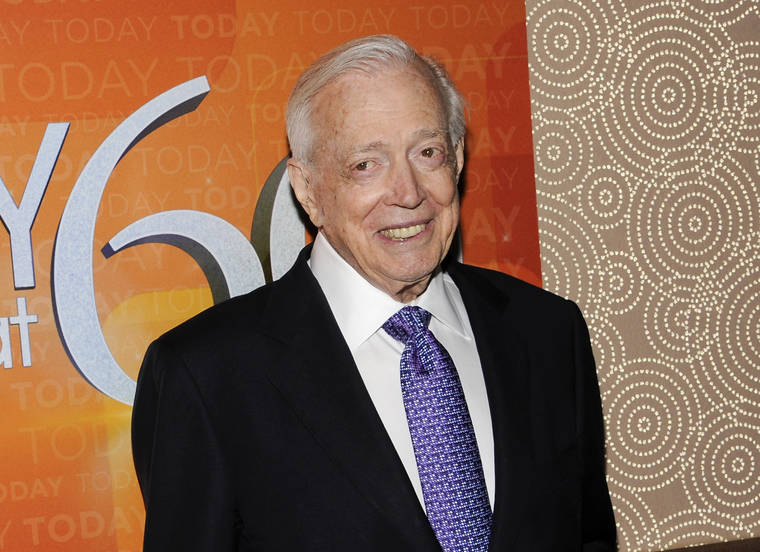 ASSOCIATED PRESS / Jan. 12, 2012
                                Hugh Downs poses for photographers while attending at the “Today” show 60th anniversary celebration in New York in 2012. Downs, a genial and near-constant presence on TV from the 1950s through the 1990s, died Wednesday at age 99.