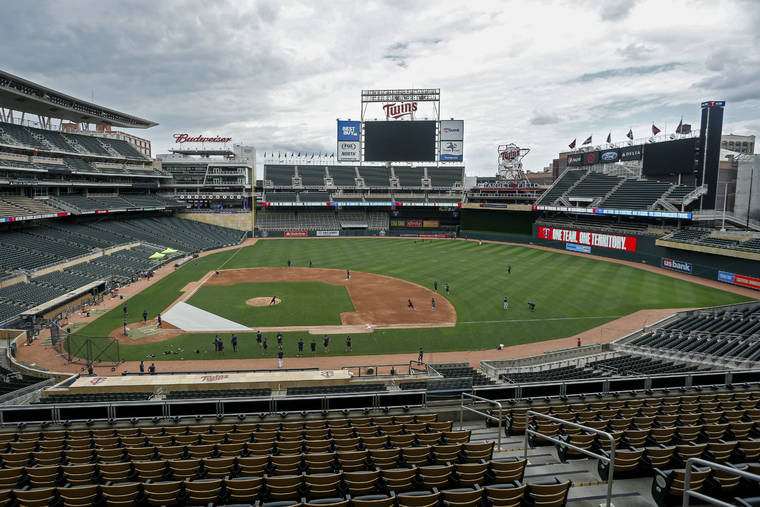 ASSOCIATED PRESS
                                The Minnesota Twins run drills on Target Field at a baseball camp today in Minneapolis.