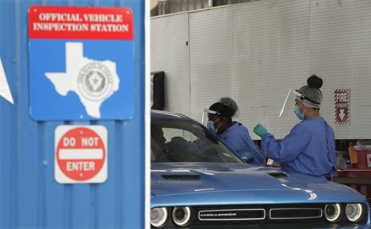ASSOCIATED PRESS / JULY 7
                                COVID-19 antibody testing and diagnostic testing are administered at a converted vehicle inspection station in San Antonio. Local officials across Texas say their hospitals are becoming increasingly stretched and are in danger of becoming overrun as cases of the coronavirus surge.