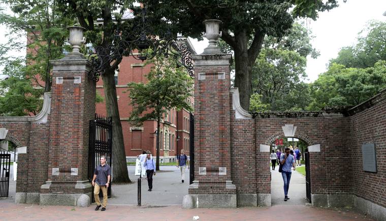 ASSOCIATED PRESS
                                Pedestrians walked through the gates of Harvard Yard, in Aug. 2019, at Harvard University in Cambridge, Mass. More than 200 universities are backing a legal challenge to the Trump administration’s new restrictions on international students, arguing that the policy jeopardizes students’ safety and forces schools to reconsider fall plans they have spent months preparing.