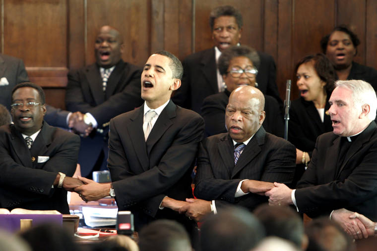 ASSOCIATED PRESS / 2007
                                From left, Brown Chapel AME Church Pastor James Jackson, Democratic presidential candidate Sen. Barack Obama, D-Ill., U.S. Rep. John Lewis, D-Georgia, and Rev. Clete Kiley, hold hands and sing at the end of a church service in Selma, Ala., on the commemoration of the Rev. Martin Luther King Jr. protest march from Selma to Montgomery, Ala. Lewis, who carried the struggle against racial discrimination from Southern battlegrounds of the 1960s to the halls of Congress, died Friday, July 17.