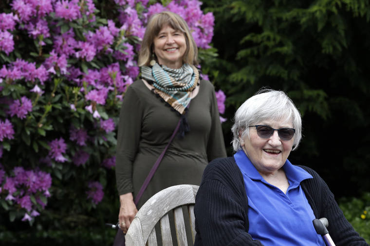 ASSOCIATED PRESS
                                Jessie Cornwell, a resident of the Ida Culver House Ravenna, right, posed for a photo with the Rev. Jane Pauw, in Seattle on May 21. Cornwell tested positive for the coronavirus but never became ill, and may have been infectious when she shared a ride to Bible study with Pauw, who later got sick with COVID-19.