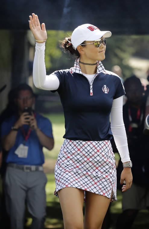 ASSOCIATED PRESS / 2017
                                Michelle Wie waves to spectators on the first hole during her singles match against Europe’s Caroline Masson, of Germany, at the Solheim Cup golf matches in West Des Moines, Iowa. Wie was appointed an assistant captain for the 2021 matches in Ohio.