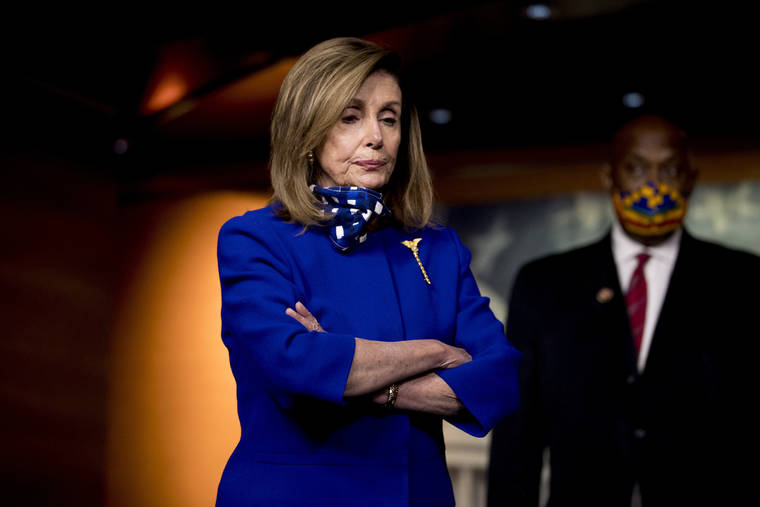 ASSOCIATED PRESS
                                House Speaker Nancy Pelosi of Calif., left, accompanied by Rep. Dwight Evans, D-Pa., right, listens to a question from a reporter during a news conference on Capitol Hill in Washington on Friday on the extension of federal unemployment benefits.
