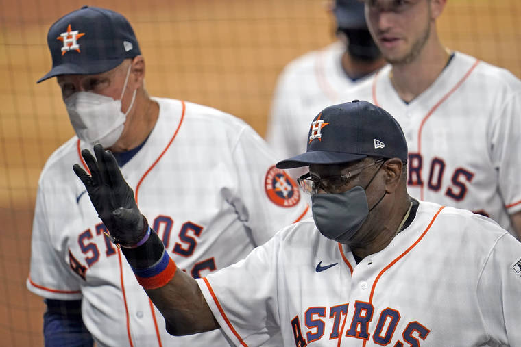 ASSOCIATED PRESS
                                Houston Astros manager Dusty Baker waves toward the stands after a baseball game against the Seattle Mariners on July 24 in Houston. The Astros won 8-2.