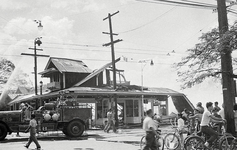 STAR-ADVERTISER
                                Half a house was left of this Honolulu residence in Japan’s attack that wreaked havoc at nearby Pearl Harbor. Cyclists watched fireman pour water on wreckage on Dec. 7, 1941.