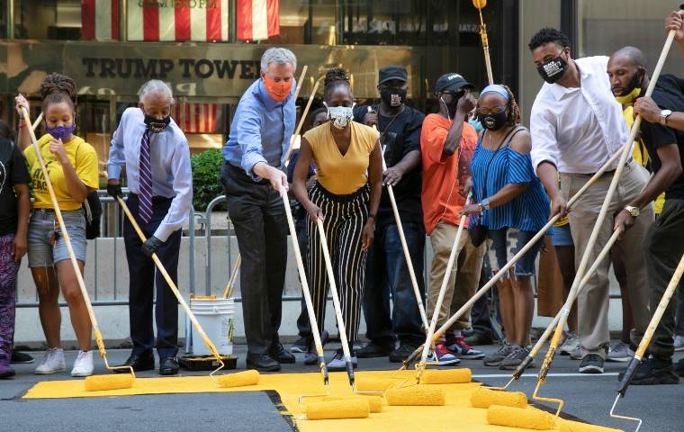 ASSOCIATED PRESS
                                Mayor Bill de Blasio, third from left, participated in painting Black Lives Matter on Fifth Avenue in front of Trump Tower, today, in New York. The mayor’s wife, Chirlane McCray, is fourth from left and Rev. Al Sharpton is second from left.