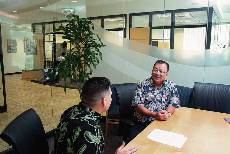 CRAIG T. KOJIMA /CKOJIMA@STARADVERTISER.COM
                                At Central Pacific Bank’s Kapiolani branch, Stanford Ono, left, vice president and branch manager, talks with longtime client Dan Le, owner of Pho Saigon, located next door to the bank.