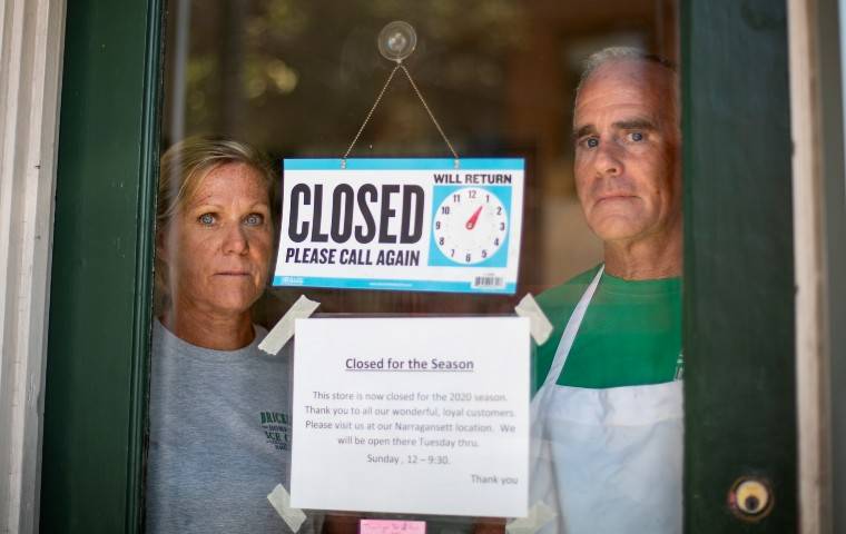 ASSOCIATED PRESS
                                Steve, right, and Chris Brophy, husband and wife owners of Brickley’s Ice Cream, looked out from the store they closed after teenage workers were harassed by customers who refused to wear a mask or socially distance, in Wakefield, R.I., today.